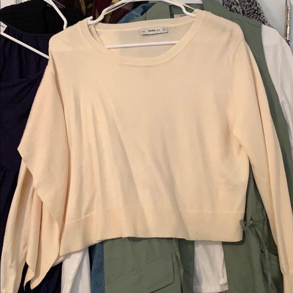 Cream cropped sweater with side detail. Size M